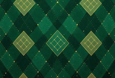 The primary subject of the image is a green and gold checkered pattern. The setting is a green and gold checkered surface, which could be a wallpaper, fabric, or carpet. The visual style is a close-up of the checkered pattern, showcasing the intricate details of the design. The colors and mood of the image are vibrant and lively, with the green and gold colors creating a warm and inviting atmosphere.